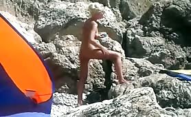 Beach nude blonde creaming her hot body